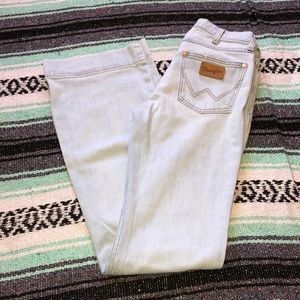 Really light blue/white high rise Wrangler jeans.